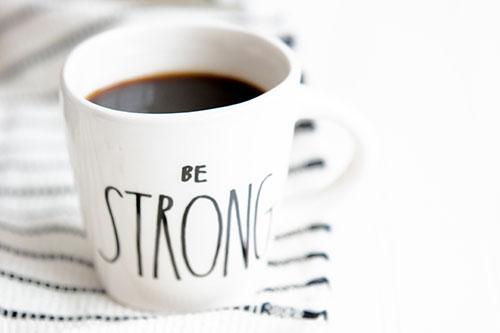 mug with words "be strong"