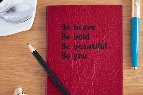 Notebook with words be brave, be bold, be beautiful, be you
