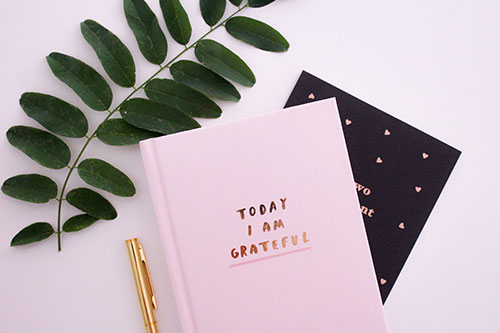 Notebook with text "Today I am grateful"